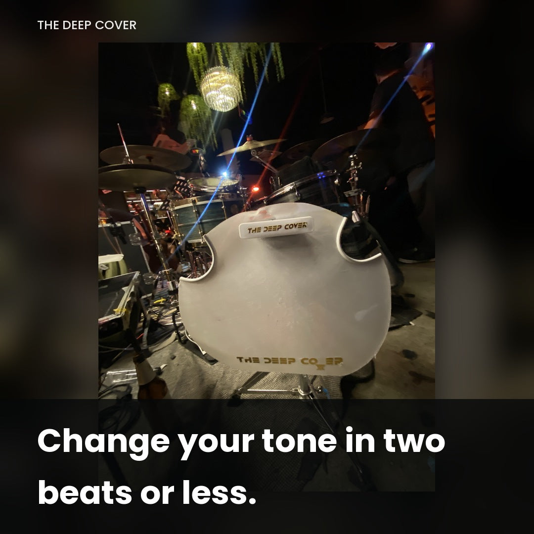 Deep Cover magnetic snare muffle attached to a floor tom during a live show with stage lights