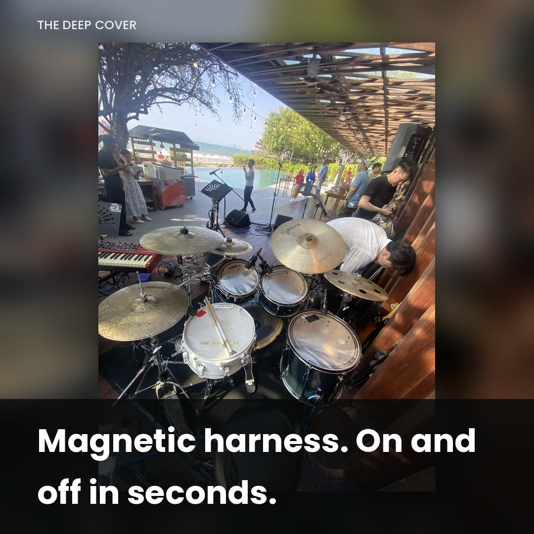 Deep Cover snare muffle mounted on a drum kit at an outdoor daytime gig, magnetic harness on and off in seconds