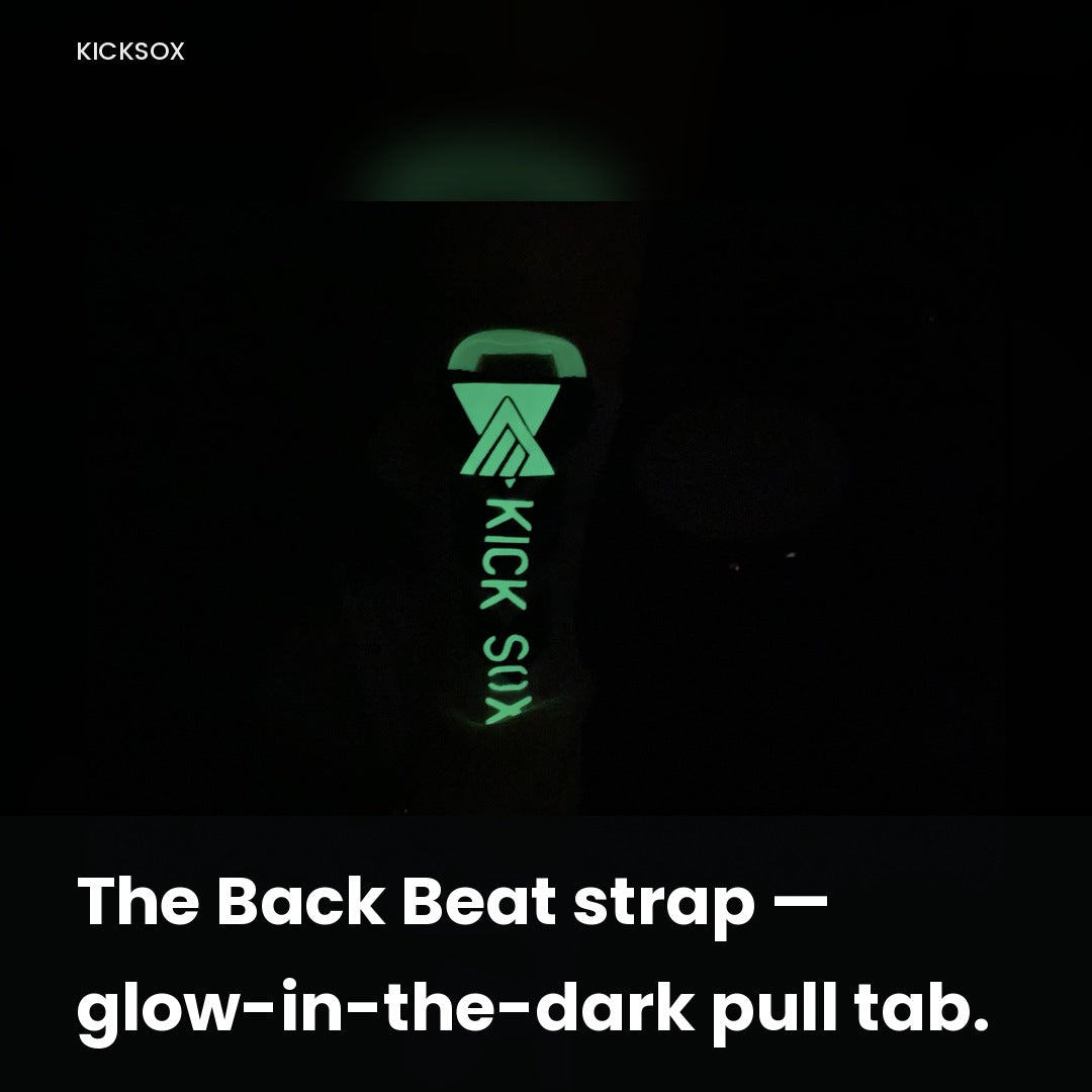 KickSox glow-in-the-dark logo pull tab glowing green in the dark